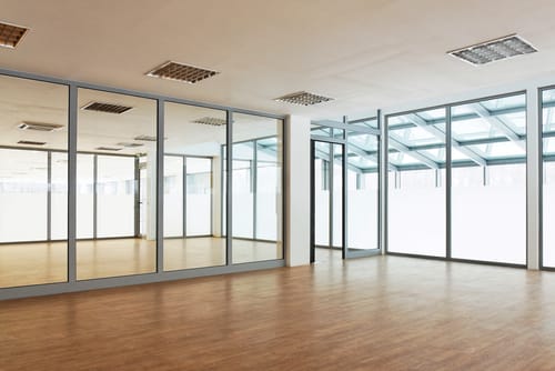 Full height glazed partition in grey
