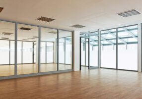 Full height glazed partition in grey